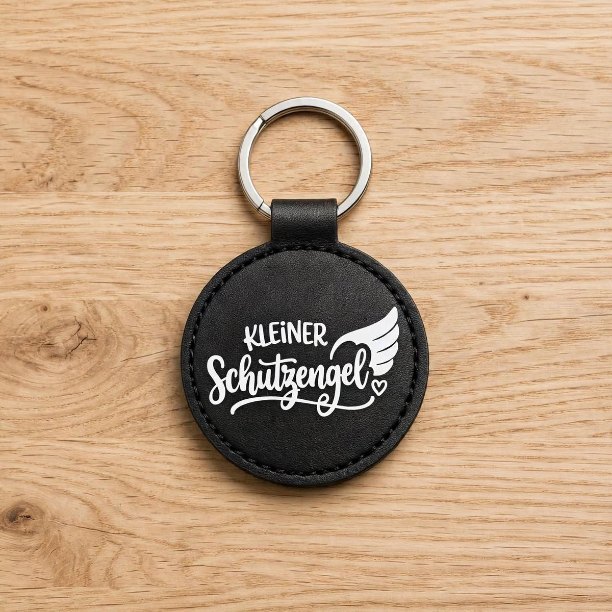 Schlüsselanhänger Kleiner Schutzengel schwarz - runder Kunstleder Anhänger mit weissem Spruch
